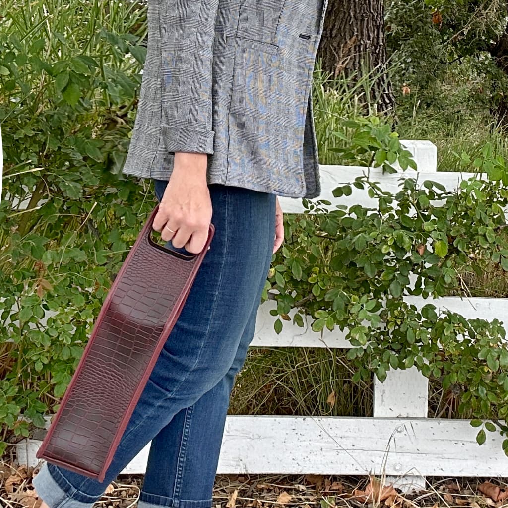 Alligator wine bottle bag with model walking