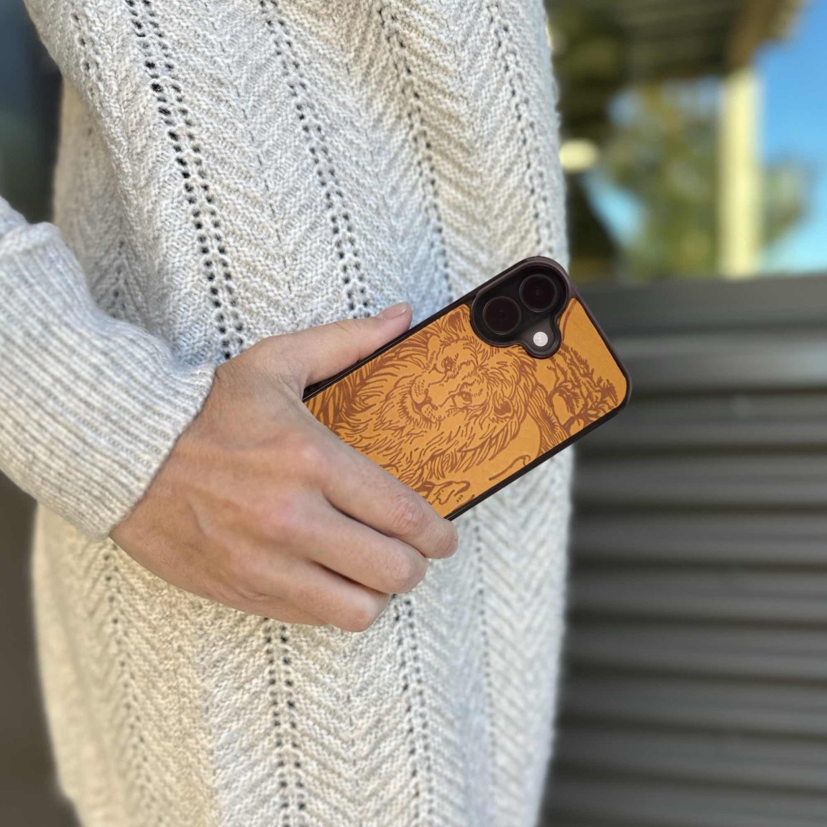 Leather iPhone case lifestyle, Lion in Marigold