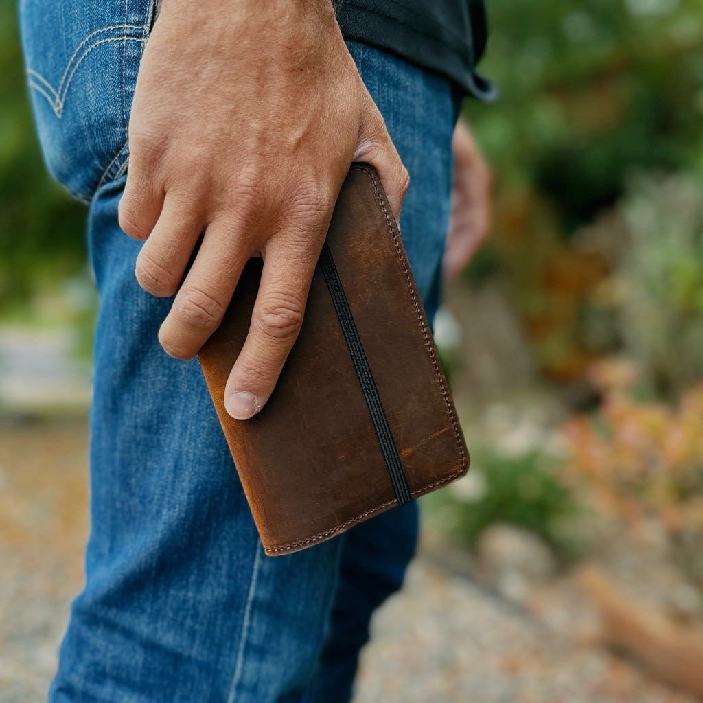 Hard Times Pocket notebook cover in a model's hand